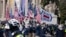 FILE - Members of the white supremacist group Patriot Front demonstrate near the National Archives in Washington, Jan. 21, 2022.