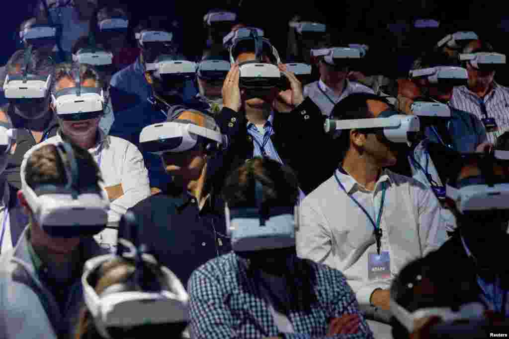 Members of the audience wear virtual reality headsets during a presentation at the CUPRA Impulse Event in Sitges, near Barcelona, Spain, June 7, 2022.