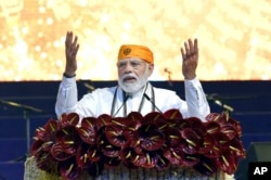 Indian Prime Minister Narendra Modi speaks at an event to mark the 400th birth anniversary of Guru Tegh Bahadur, the ninth Sikh guru who is remembered for championing religious freedoms for all, at the historic Mughal-era Red Fort, New Delhi, April 21, 2022.