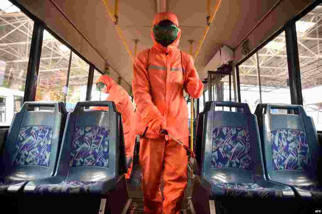 Health officials of the Ryonmot Trolley Bus Office disinfect a trolley bus, as part of preventative measures against the Covid-19 in Pyongyang, North Korea.&nbsp;(Photo by KIM Won Jin / AFP)