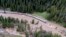 This aerial photo provided by the National Park Service shows a flooded out North Entrance Road, of Yellowstone National Park in Gardiner, Montana, on June 13, 2022. 
