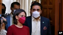 German Foreign Minister Annalena Baerbock, center left, and her Pakistani counterpart. Bilawal Bhutto Zardari. arrive for a press conference after their meeting in Islamabad, Pakistan, June 7, 2022. 