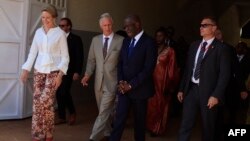 Belgium's Queen Mathilde (L) and Belgium's King Philippe (2nd L) and Doctor Denis Mukwege (2nd R) leave the headquarters of the Panzi Foundation, founded by Mukwege, in Bukavu, DRC, June 12, 2022.