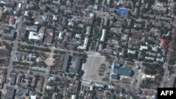 This satellite image released by Maxar Technologies on June 7, 2022 shows damaged buildings from artillery shelling, downtown Sievierodonetsk near Chemist's Palace of Culture, June 6, 2022. (Photo by Satellite image ©2022 Maxar Technologies / AFP)