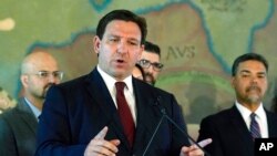 FILE - Florida Gov. Ron DeSantis speaks at Miami's Freedom Tower, May 9, 2022. The Special Olympics has dropped a coronavirus vaccine mandate for its games in Orlando after Florida moved to fine the organization $27.5 million.