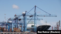 FILE: A container ship is seen as its docked next to cranes at the port of Mombasa, Kenya, October 23, 2019.