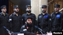 Afghan Taliban's Interior Ministry Spokesman Abdul Nafi Takor speaks at a news conference about the new Afghan police uniform in Kabul, Afghanistan, June 8, 2022. 