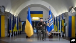 Ukrainian President Volodymyr Zelenskyy answers media questions during a press conference in a city subway under a central square in Kyiv, Ukraine, April 23, 2022.