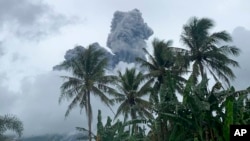 Ash and steam rise from Mount Bulusan, as seen from Casiguran, Philippines, on June 5, 2022.