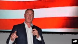 FILE - Montana House candidate and former Secretary of Interior Ryan Zinke speaks onstage at an event hosted by Butte-Silver Bow County Republicans at the Copper King Hotel and Convention Center, May 13, 2022, in Butte, Mont.