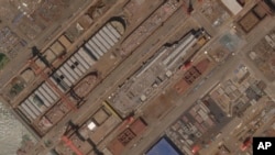 This satellite image from Planet Labs PBC shows construction of China's Type 003 aircraft carrier at the Jiangnan Shipyard northeast of Shanghai, China, May 8, 2022. 