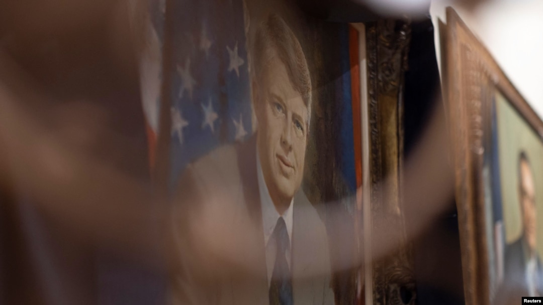 Black fabric is displayed on the official state portrait of late former US President Jimmy Carter by Robert Templeton at the Georgia State Capitol building in Atlanta, Georgia, Jan. 3, 2025.