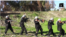 Chilren are seen carrying weapons and performing military drills in this still from an IS video called 'Blood of Jihad 2.'