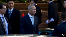 FILE - Chinese Vice Premier Liu He leaves after a ministerial-level trade meeting at the Office of the United States Trade Representative, in Washington, Oct. 11, 2019.