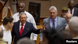 Cuba's President Raul Castro (C-L) and First Vice-President Miguel Diaz-Canel (C-R) arrive for a session of the National Assembly in Havana, Cuba, April 18, 2018. Diaz-Canel was named to succeed Castro Thursday.