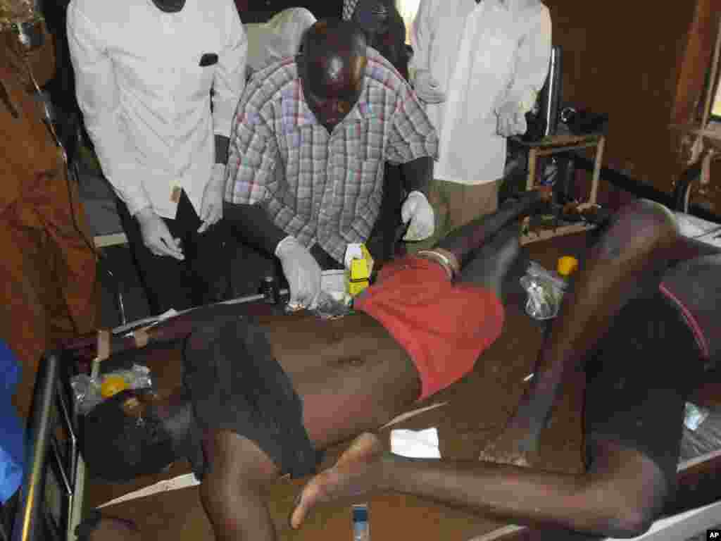 People wounded in a suicide bomb attack are treated at the general hospital in Potiskum, Nigeria, Nov. 10, 2014. 