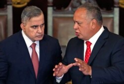 Venezuela's National Constituent Assembly President Diosdado Cabello, right, talks to Chief Prosecutor Tarek William Saab during a ceremony honoring the Supreme Court in Caracas, Jan. 24, 2019.