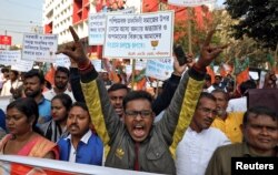 Supporters of India's ruling Bharatiya Janata Party shout slogans during a rally in support of a new citizenship law, in Kolkata, India, Feb. 4, 2020.