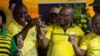 South African President Cyril Ramaphosa, left, and former president Jacob Zuma, center, celebrate the 107th anniversary of the African National Congress, in Durban, South Africa, Jan. 8, 2019.