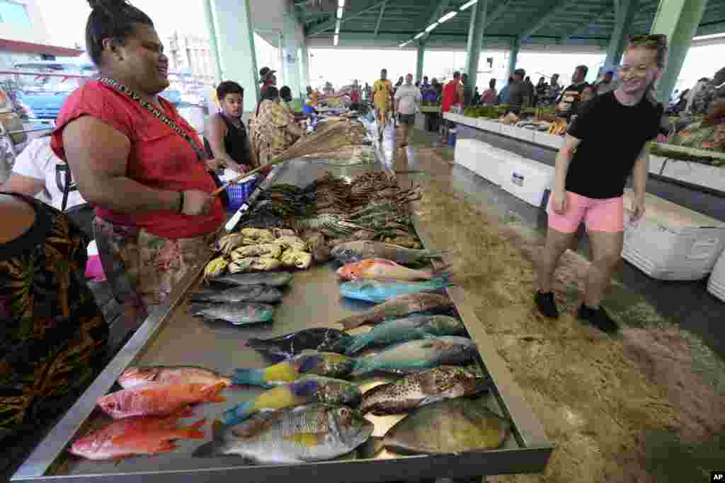 Colorful fish are displayed for sale at a fish market in Apia, Samoa.