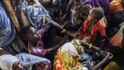FILE- Civilians fleeing conflict in Sudan wait for asylum registration procedures at the United Nations High Commissioner, in Renk, South Sudan on December 18, 2023.