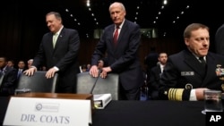 From left, CIA Director Mike Pompeo, Director of National Intelligence Dan Coats, and National Security Agency Director Adm. Michael Rogers take their seats on Capitol Hill in Washington, May 11, 2017.