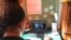 FILE - Katie Griffin, a junior at Norristown Area High School, takes part in virtual Spanish class at her home in Norristown, Pa., Sept. 3, 2020.