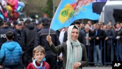 FILE - Supporters of Turkey's President Recep Tayyip Erdogan gather for a rally ahead of the upcoming referendum, in the predominantly Kurdish Diyarbakir, in southeastern Turkey, April 1, 2017. 