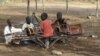 Sudanese children play with a broken playground chair in Kakuma refugee camp in Kenya. (File Photo)