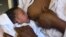 FILE - A mother is seen breastfeeding her child.