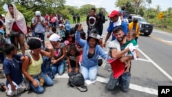 Migrants beg and pray not to be taken away by Mexican immigration authorities during a raid on a migrant caravan that had earlier crossed the Mexico-Guatemala border, near Metapa, Chiapas state, Mexico, June 5, 2019.