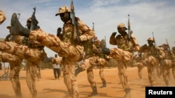 FILE - Chadian soldiers march a training mission for African militaries, in Diffa, Niger, March 3, 2014. A multi-national military force in Africa's Sahel region launched its campaign Oct. 28.