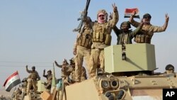 Iraqi security forces deploy in Rawah, northwest of Baghdad, Iraq, Nov. 17, 2017. Iraqi forces backed by the U.S.-led coalition retook the last town in the country that was held by the Islamic State group.