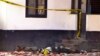 FILE - One of the bodies of three women who were shot dead by police lies outside the central police station in the coastal city of Mombasa, Kenya, Sept. 11, 2016.