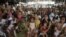 Filipino women and their children participate in a family planning fair to commemorate World Population Day in Manila, Philippines, July 11, 2012