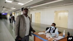 A traveler is screened for symptoms of Ebola upon his arrival at the Jomo Kenyatta International Airport in Nairobi, Kenya, June 17, 2019.