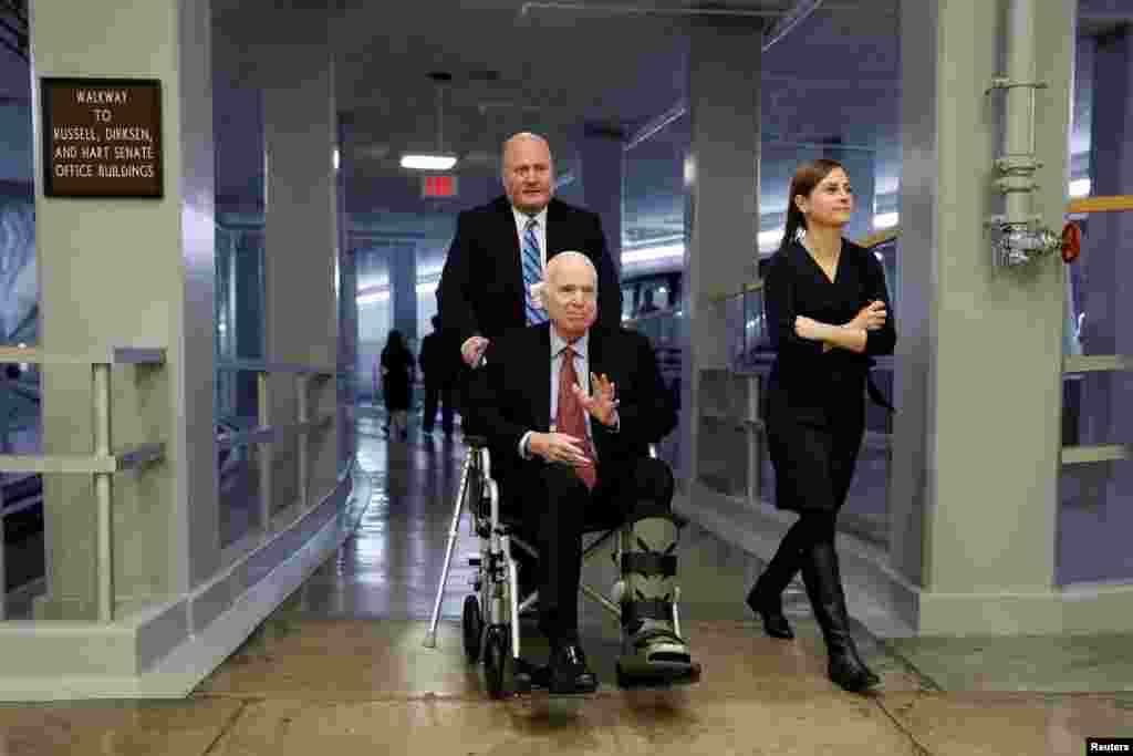 Sen. John McCain heads to the Senate floor ahead of votes on Capitol Hill in Washington, Dec. 6, 2017.