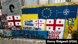 Pro-Western, anti-Russian graffiti can be seen on the streets of Tbilisi, Georgia, Oct. 11, 2024, in the run-up to elections on Oct. 26.