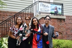 Maris Medina poses with her family on her graduation day in 2020 in Rockville, Maryland. (Bethany Swain/VOA)