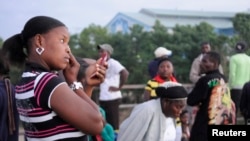 FILE - Haitian residents, who have been living and working undocumented in the Dominican Republic wait for Dominican immigration officials to allow them back, at a border post in Ouanaminthe, January 10, 2013.