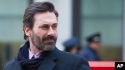 Jon Hamm helps unveil a "Mad Men" bench in front of the Time & Life Building, March 23, 2015 in New York. 