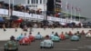 Children take part in the Settrington Cup Pedal Car Race as motoring enthusiasts attend the Goodwood Revival, a three-day historic car racing festival in Goodwood, near Chichester, southern Britain, Sept. 8, 2024. 