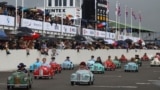 Children take part in the Settrington Cup Pedal Car Race as motoring enthusiasts attend the Goodwood Revival, a three-day historic car racing festival in Goodwood, near Chichester, southern Britain, Sept. 8, 2024. 