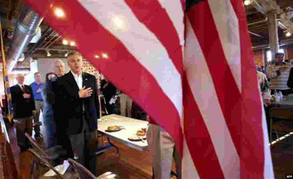 Republican 2012 presidential candidate, Former Utah Gov. Jon Huntsman says the Pledge of Allegiance at the Laconia Rotary luncheon in Laconia, N.H., Thursday, Dec. 29, 2011. (AP Photo/Cheryl Senter)