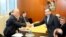 Iran's deputy Foreign Minister Abbas Araghchi (R) and Director General of the International Atomic Energy Agency, IAEA, Yukiya Amano shake hands prior to a meeting at the International Center in Vienna, Austria on Oct. 28, 2013.