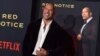 Dwayne Johnson dalam peluncuran perdana film "Red Notice" di Los Angeles, 3 November 2021. (Jordan Strauss/Invision/AP)