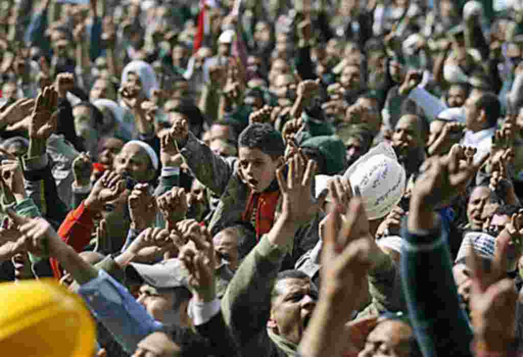 Anti-government protestors react in Tahrir Square, Cairo, Egypt, February 4, 2011
