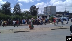 Ethiopians line up at a government-operated stand in Addis Ababa to purchase cooking oil and sugar, April 13, 2011