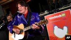 FILE - Musician John Fogerty performs at the Woodstock 50 lineup announcement at Electric Lady Studios, March 19, 2019, in New York. 