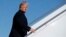 President Donald Trump boards Air Force One for a trip to Cincinnati to promote his tax policy, Feb. 5, 2018, in Andrews Air Force Base, Maryland.